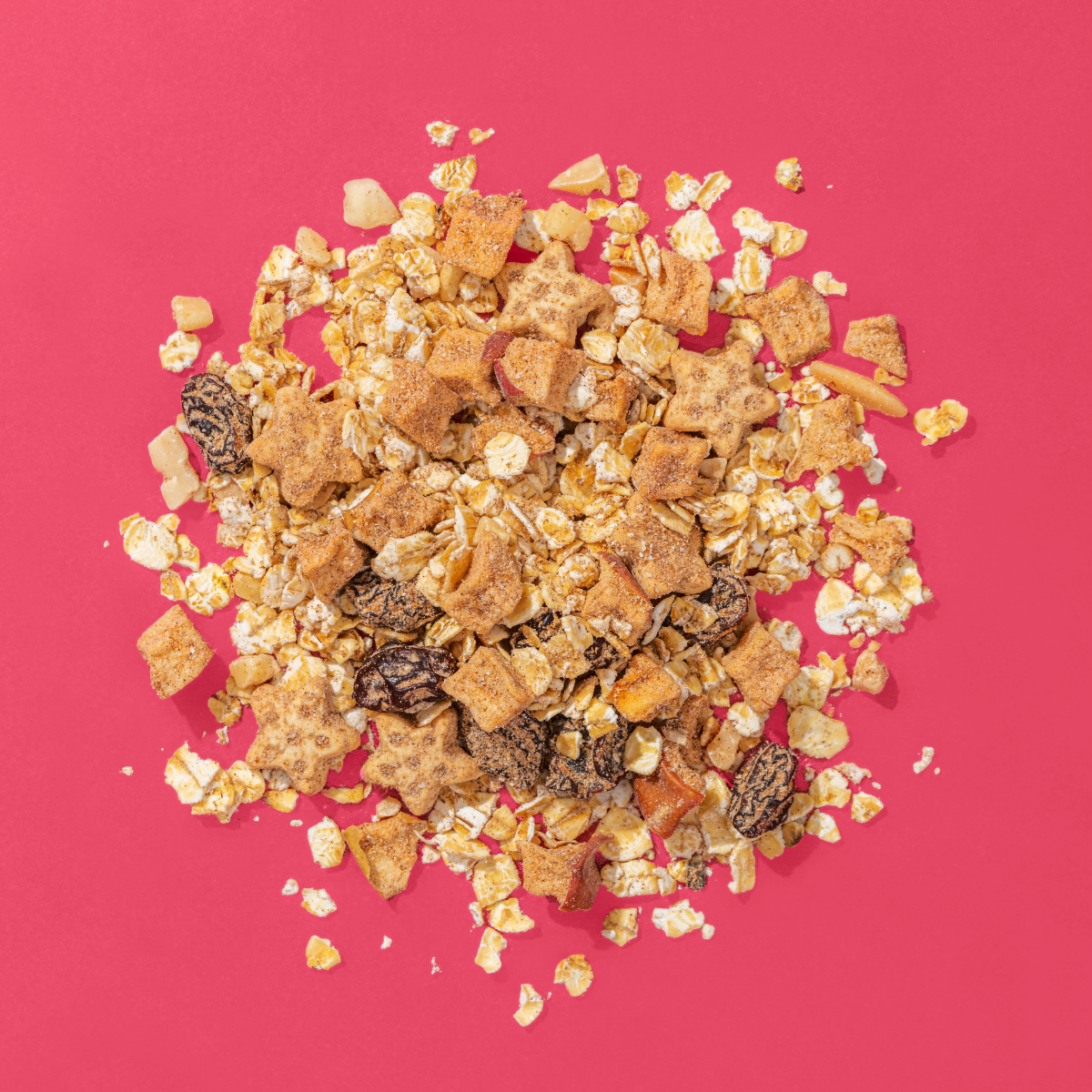 Porridge Zutaten auf einem Haufen, Haferflocken, Bratapfelsterne, Rosinen únd Apfelstücke