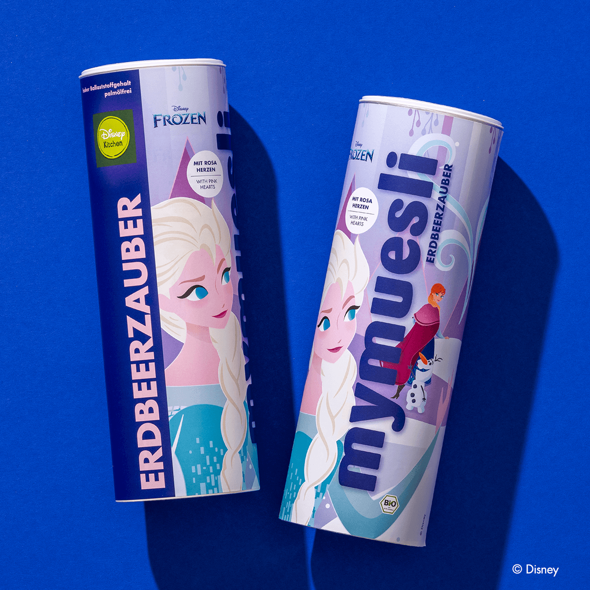Zwei Disney Erdbeerzauber Müsli Dosen nebeneinander mit Elsa, Olaf und Anna im Design