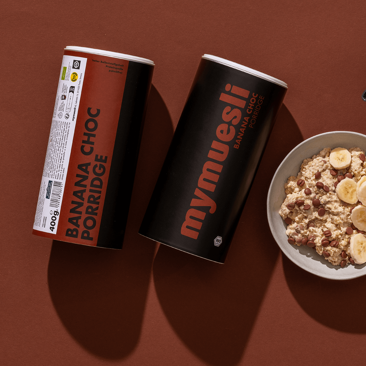 mymuesli Bio Porridge Banana Choc Dosen mit Müslischale