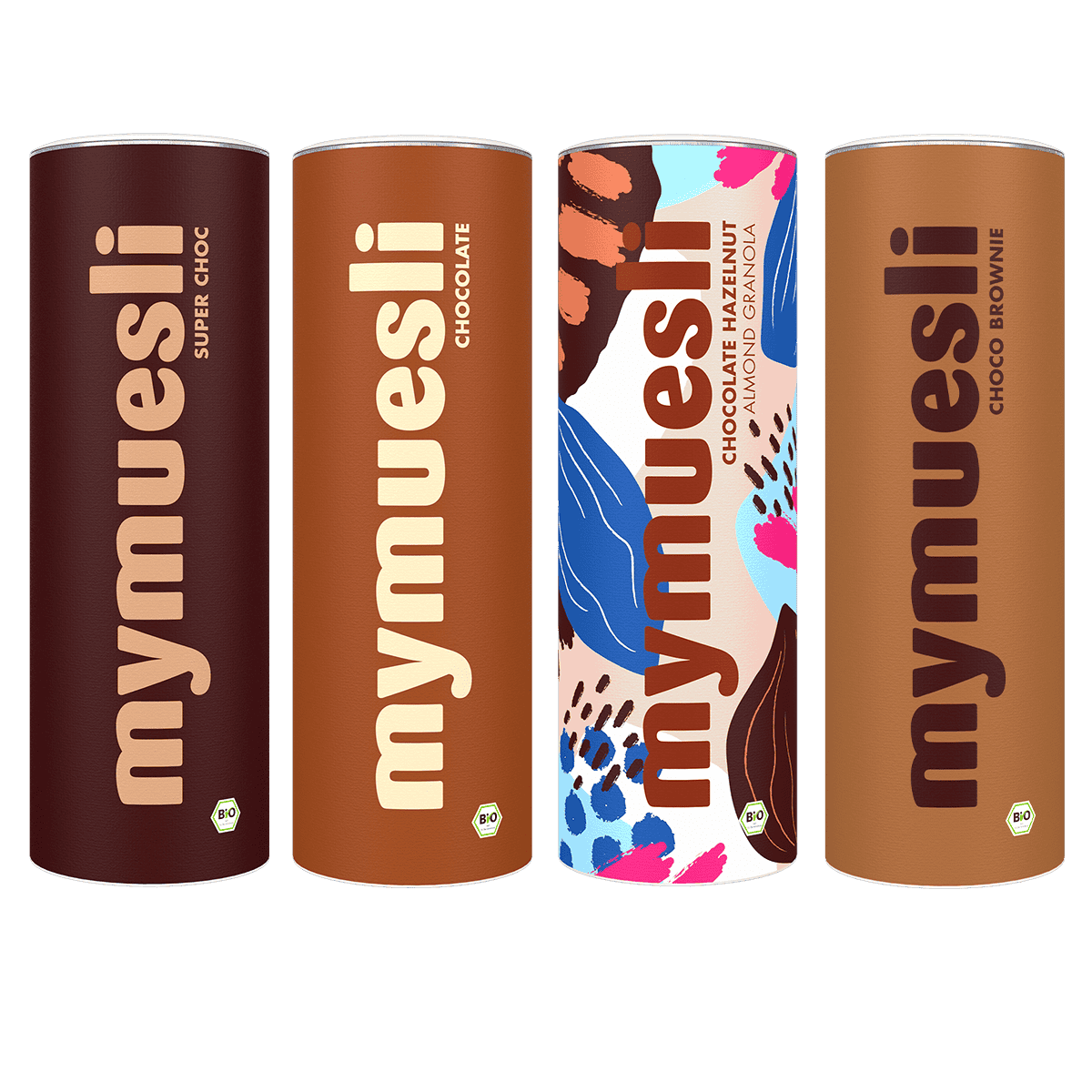 Vier verschiedene mymuesli -Dosen in Braun- und Beigetönen sowie eine bunt gemusterte Dose in einer Reihe auf grünem Hintergrund.