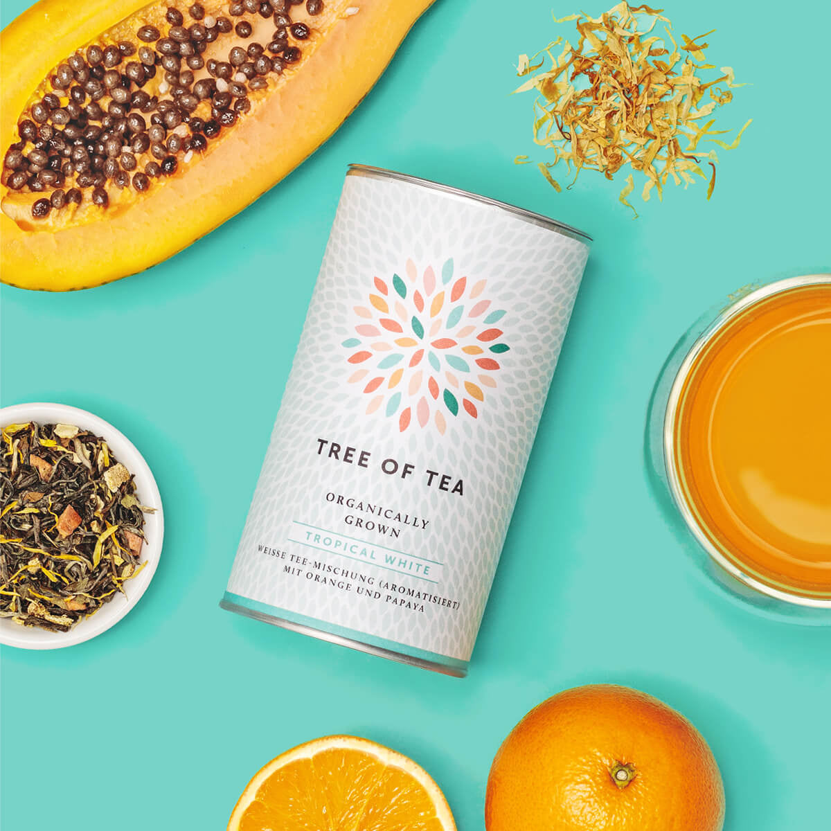 Tree of Tea Tropical White Weißer Tee mit Papaya und Orange daneben
